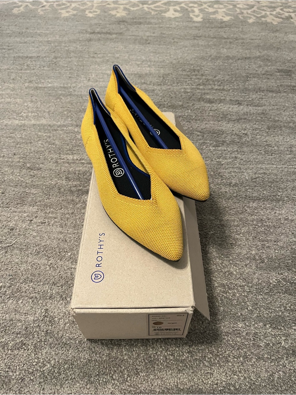 Rothy's Pointed Toe Flats in Marigold with Navy Lining